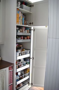 an open pantry door with food in it