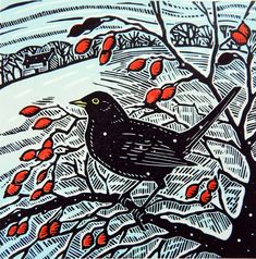 a black bird sitting on top of a tree filled with red berries in the snow