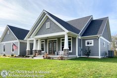 a house with gray siding and white trim