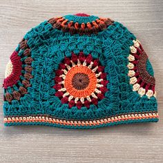 a crocheted hat is sitting on a table