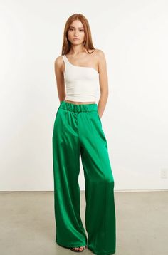 Sleek Silk High-waisted Wide Leg Pants, Silk Wide Leg Pants With Elastic Waistband For Work, Sleek Silk Wide Leg Bottoms, Sleek Satin Wide Leg Pants, Satin Wide Leg Pants For Workwear, Sleek Silk Pants For Spring, Chic Green Satin Bottoms, Chic High Waist Silk Wide Leg Pants, Chic High-waist Wide Leg Silk Pants