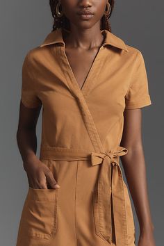 71% cotton, 26% Tencel, 3% elastane Cropped inseam Front and back patch pockets Belted styling Back zip Machine wash Imported | Wrapped Culotte Jumpsuit by Maeve in Beige, Women's, Size: 10, Cotton/Elastane/Tencel at Anthropologie Beige Jumpsuit, Denim Culottes, Brown Jumpsuits, Wrap Jumpsuit, Culotte Jumpsuit, Belt Style, Pocket Belt, Back Patch, Denim Jumpsuit