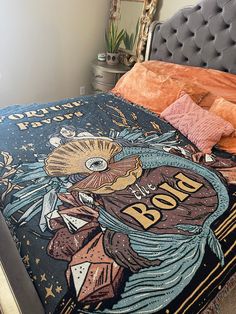 the bed is made up with an image of a woman on it