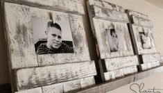 three wooden frames with pictures hanging on them