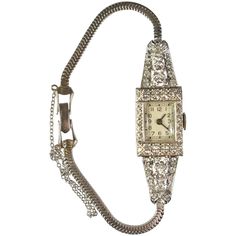 A stunning Art Deco style platinum ladies wristwatch with diamonds. This beautiful watch features a platinum case surrounded by 1.75-carat of diamonds. The case is marked 900 platinum. It has a 17 jewel movement, Alleman & Gisiger. The original dial is in very good condition and the band is 14-karat. The watch is running but has not been serviced. Measures: 6.5" long and weighs 20.6 grams. Art Deco Ladies, Lady Watch, Art Deco Watch, Antique Costume Jewelry, Art Deco Lady, Vintage Inspired Jewelry, Estilo Art Deco, Deco Jewelry, Women Wrist Watch