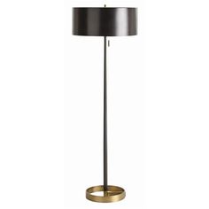 a floor lamp with a black shade and gold trim around the base, on a white background