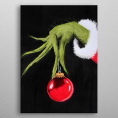 an acrylic painting of the grin face hanging from a christmas ornament