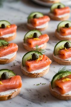 A photo of a  Elegant Smoked Salmon Canapés a New Years Eve Food Party Ideas Smoked Salmon Creme Fraiche Appetizer, Smoked Salmon Party Food, Salmon Board Ideas, Smoked Salmon Charcuterie Board Ideas, New Year's Eve Food Ideas, Seafood Birthday Party Ideas, Food Ideas For New Years Eve Party, Cold Canapes Ideas, New Year Eve Dinner Ideas