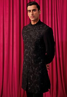 Step into the spotlight with our Black Floral Embroidered Sherwani Set. This exquisite ensemble features a heavily embellished achkan, adorned with large geometrically hand-embroidered floral work. Paired with a kurta and bell-bottom pants, it exudes elegance and sophistication. Perfect for weddings and festivals, this sherwani set will make you the centre of attention. Ideal for grooms and members of the groom's family, this set is sure to impress. Composition : Jacket, Kurta & Pants: Premium Suiting Care: Dry Clean Only and Vacuum Storage This product can be customized for sleeves, length of blouse and neckline Delivery : 4-6 weeks as the product is hand crafted. Check Size Guide or choose MySize for free customisation (All Sizes above XL can be made at 15% additional cost) For more info Kurta Pants, Embroidered Sherwani, Floral Work, Indian Wedding Wear, Kurta With Pants, Bell Bottom Pants, Wedding Wear, Bell Bottoms, Indian Wedding