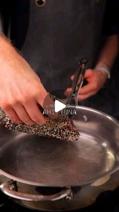 a person is using a pair of scissors to cut something in some kind of food