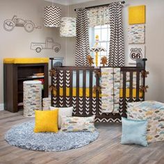 a baby's room with yellow and gray decor, including a crib bedding set