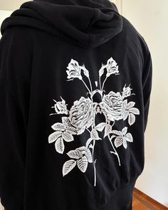 B&W sweat shirt with floral design on backside full zip-up, fits sz large or comfy oversized hoodie Black Casual Hoodie With Embroidered Graphics, Black Hooded Hoodie With Back Print, Black Skeleton Zip Up Hoodie, Black Anime Print Hoodie With Crew Neck, Black Cotton Anime Print Hoodie, Zip Up Hoodies, Embroidery Craft, Hoodie Design, Flower Designs