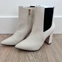 Super Cute Boots With Black Side Detail And Gold Zipper. Perfect With A Dress Or Pants. Brand New, Never Been Worn. Color Is Close To An Off White Or Taupe. Spring Ankle-high Heeled Boots With Zipper, Chic Round Toe Boots With Side Zipper, Trendy Spring Boots With Side Zipper, Chic High Ankle Boots With Zipper Closure, Spring Faux Leather Boots With Zipper Closure, Beige Pointed Toe Boots With Zipper Closure, Chic High Heel Boots With Zipper Closure, Chic White Boots With Zipper, Chic White Boots With Zipper Closure