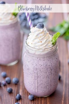 two mason jars filled with blueberry milkshake