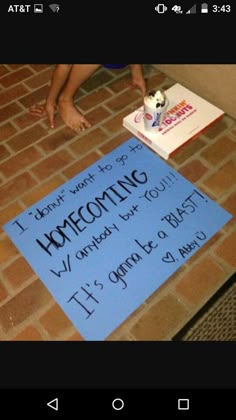 a child sitting on the floor next to a sign that says, i don't want