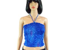 Vintage tube top or halter top in blue with some purple highlights. This 80s crop top & stretches is terivoile tie dye clothing perfect beach cover. The Electric blue tropical elastic bandeau is retro cool. Visit Our Shop https://www.etsy.com/shop/MirrorballBoutique LABEL: NA MATERIAL: NA, think its Terivoile COLOR: Blues & Purple SIZE/FIT:  N/A ARMPIT TO ARMPIT: 10"- 20" (stretched) TOP TO BOTTOM: 11" CONDITION: Good Vintage #3 ALL OF OUR ITEMS ARE VINTAGE MEANING 20 YEARS OR OLDER. THESE ARE P Blue Stretch Crop Top Tube Top, Blue Bandeau Tops For Night Out, Blue Fitted Bandeau Tank Top, Fitted Blue Bandeau Tank Top, Purple Halter Neck Crop Top, Blue Strapless Tank Top For Summer, Summer Blue Halter Top For Night Out, Summer Purple Halter Top For Night Out, Purple Halter Top For Summer Nights