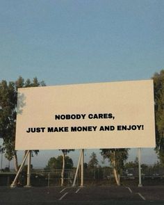 a billboard that says nobody cares, just make money and enjoy