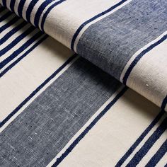 blue and white striped fabric with vertical stripes on the bottom, in two different colors