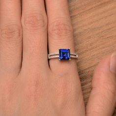 It is a lab blue sapphire ring. The main stone is 7mm*7mm square cut, weight about 2.29carats. The basic metal is sterling silver and plated with rhodium. To change the metal to a solid gold (white/rose) or platinum is also available, please ask for a quotation if you want. You can also go to my shop Home for more elegant rings: https://www.etsy.com/shop/godjewelry?ref=hdr_shop_menu More rings: https://www.etsy.com/shop/godjewelry?ref=l2-shop-header-avatar Customization is always welcome and ple Blue Square Cut Sapphire Promise Ring, Square Cut Blue Sapphire Promise Ring, Rectangular Lab-created Sapphire Ring For Anniversary, Anniversary Rectangular Lab-created Sapphire Ring, Square Cut Sapphire Ring For Gift, Square Cut Sapphire Ring For Anniversary, Square Cut Sapphire Ring As Gift, Blue Square Cut Sapphire Wedding Ring, Blue Rectangular Lab-created Sapphire Rings