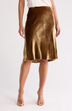 The skirt silhouette of the season is best worn in a silk-kissed satin fabrication. 27" length (size Medium) 82% viscose, 18% silk Dry clean Imported Skirt Outfits Dressy, Dressy Winter, Satin Skirt Outfit, Winter Cocktail, Satin Slip Skirt, Outfits Dressy, Winter Cocktails, Slip Skirt, Satin Slip