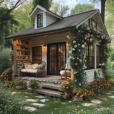 a small house with lots of flowers around it