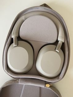 an open case with two headphones in it