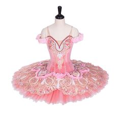 a pink and white ballerina dress on a mannequin headdress with sequins