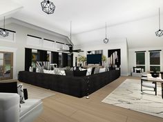 a large living room with white walls and black furniture