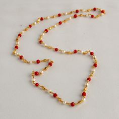 Embrace the allure of tradition with our Coral Pearl Necklace--a fusion of antique charm and Jaipuri elegance. This Mala set, a blend of traditional and fancy elements, features vibrant coral color beads and lustrous pearls. The necklace exudes sophistication, complementing any outfit effortlessly.  This personalized jewelry piece is my own design, and I welcome any customization requests. Elevate your style with this exquisite Indian jewelry. Length - 30 inch Indian Coral Jewellery Gold, Pearl Coral Necklace Indian, Coral And Pearl Jewellery, Pearl And Coral Gold Chain, Traditional Festive Necklace With Delicate Chain, Traditional Wedding Necklace With Delicate Chain, Traditional Wedding Jewelry With Delicate Chain, Pearl Chain Necklace For Diwali Gift, Traditional Pearl Chain Necklace For Ceremonies