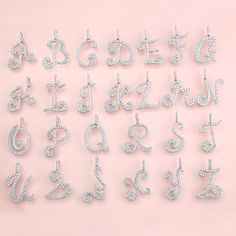 the letters and numbers are made out of swarong crystal stones on a pink background