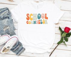 Groovy Retro School Counselor Shirt, Gift For Guidance Counselor, School Counseling Therapist, Unisex Graphic Tee School Counselor Unisex T Shirt, Women Racerback Tank, Long Sleeve T-Shirt Tees Tshirt Sweatshirt Sweater Hoodie Gift For Men Women Boys Girls Well, let's say goodbye to all this boring apparel... The GodBlessThisDesign team creates custom clothes with great designs to suit all tastes. Our unique and blessed designs are a blast fit for every occasion and always a perfect fit... We co Occupational Therapy Shirts, Slp Shirts, Therapist Gifts, Occupational Therapist, Occupational Therapy, Nice Design, T Shirt Women, Gift For Men, Shirt Women