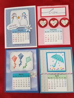 four different calendars are displayed on a red tablecloth with hearts and umbrellas