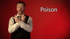 a man standing in front of a red wall with the word poison written on it