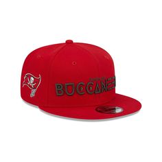 Perfect your Tampa Bay Buccaneers game day outfit by picking up this Word 9FIFTY snapback hat. It features the team's name embroidered on the front in a striking fashion, as well as their unmistakable logo on the right side. The structured fit of this New Era cap will quickly turn it into your number one option for representing the Tampa Bay Buccaneers.Perfect your Tampa Bay Buccaneers game day outfit by picking up this Word 9FIFTY snapback hat. It features the team's name embroidered on the fro Flat Brim Snapback Hat For Sports Fans, Game Day Snapback Hat With Team Logo, Fan Gear Snapback Hat With Team Logo, Snapback Hat With Team Logo For Fan Gear, Game Day Snapback Baseball Cap With Team Logo, Game Day Snapback Cap With Team Logo, Sports Fan Snapback Hat With Team Logo, Team-colored Flat Brim Trucker Hat For Sports Events, Flat Bill Snapback Hat For Baseball Season