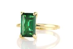 Celebrate special moments and spontaneous ones with this Emerald ring. This alluring and luscious gold ring is simple yet classically elegant. You can style this with other Emerald jewelry pieces. Great for special and casual occasions. Wearable on its own or with other jewelry pieces. Elegant gift for mom, sister, or wife. You can choose your ring size. Thoughtfully packaged in a beautiful jewelry box. Product specifications Jewelry Information Metal stamp 14K Metal Gold Filled Gem Type Emerald Elegant Polished Emerald Open Ring, Elegant Emerald Sterling Silver Open Ring, Elegant Gold Emerald Ring With Polished Finish, Elegant Green Stackable Rings For Anniversary, Elegant Emerald Stackable Open Rings, Elegant Open Ring Emerald For Anniversary, Elegant Polished Emerald Cut Emerald Ring, Elegant Emerald Stackable Rings For Formal Occasions, Elegant Emerald Cut Emerald Ring With Polished Finish