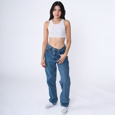 Vintage 90s jeans by Armani in blue denim with a high waist and a straight leg with a slight taper. Please see measurements and condition below. Every garment we sell is authentic vintage! You will receive the exact item photographed. Condition: Very good vintage. Best fits women's: Labelled 30 Tag: armani Material:  denim MEASUREMENTS Taken from seam to seam while the garment is lying flat. Double the armpit, waist, and hips For reference, model is 5'5" and measures 31-24-35. Waist: 15" Hips: 19.5" Inseam: 30" Rise: 11" For sales and promotions, follow us @Shopexile 90s Style Wide Leg Jeans, 90s Blue Straight Leg Cargo Jeans, 90s Style Mid-rise Cargo Jeans, 90s Style Straight Leg Cargo Jeans For Spring, 90s Mid-rise Streetwear Jeans, 90s Style Straight Leg Flare Jeans For Streetwear, Y2k Style Medium Wash Straight Leg Cargo Jeans, 90s Inspired Wide Leg Denim Jeans, 90s High Waist Denim Blue Flare Jeans