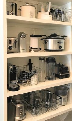 the shelves are full of kitchen appliances and cooking utensils