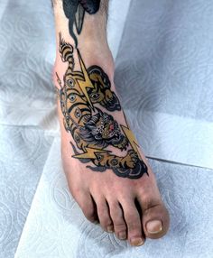 a person with a tattoo on their foot