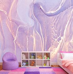 a bedroom with purple and pink decor on the walls