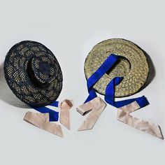 Hand-crafted Navy Blue Sisal (top of the hat) and Natural Sinamay Straw/Twine (inner hat) with Two-Tone Silk Dupion Ribbons in Royal Blue and Light Pink color from the "Sunrise in London" Hat and Headpiece Collection by Stavroula P. Spyrou A Cartwheel Hat that can be worn during your summer walk or on special occasions such as Royal Ascot, Kentucky Derby, Wedding Day. The silk embroidered ribbons can be tied in two different ways: Creating a bow or a simple tie at the front of the lower part of Navy Beach Hats For Spring, Navy Beach Hat For Spring, Navy Spring Beach Hat, Navy Hat For Spring, One Size Fits Most, Blue Panama Hat For Kentucky Derby, Navy Hat For Spring (one Size Fits Most), Spring Navy Hat, Blue Woven Straw Hat With Wide Brim, Blue Woven Wide Brim Sun Hat