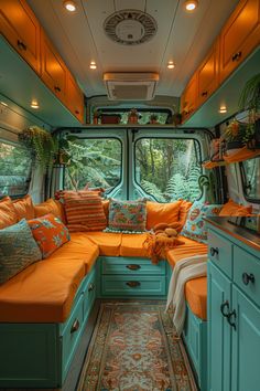 the inside of an rv with lots of pillows and cushions on the couch, along with other furniture