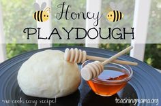 a honey playdough is sitting on a black plate