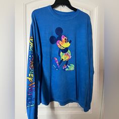 Brand New With Tags! Disney Blue Top For Streetwear, Casual Long Sleeve T-shirt For Disney Trips, Casual Long Sleeve Tops For Disney Fan Events, Blue Long Sleeve Top With Mickey Mouse, Blue Long Sleeve Disney Top, Fun Blue Long Sleeve T-shirt, Blue Cotton Mickey Mouse T-shirt, Blue Mickey Mouse Cotton T-shirt, Blue Disney Tops For Disney Trips