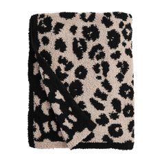 a black and white blanket with an animal print