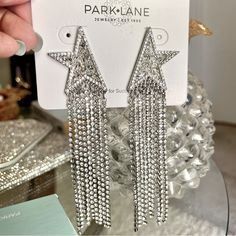 These Half Stars Are Seen In High End Designer Shoes, Clothes And Accessories. These Shoulder Duster Fringe Earrings Are Not For The Meek Or The Mild, They Totally Shout “Fun”. Perfect To Style Up Or Down . How About Styling It With Western Boots, A Cowboy Hat, And Your Favorite Jeans? These Designer Hand-Set Crystals Earrings Are 4 ½” In Length And Will Totally Move With You. Star Fringe Earrings, Silver Star Embellished Earrings For Party, Silver Star Jewelry For Party, Silver Star Charm Earrings For Party, Crystals Earrings, Park Lane Jewelry, Park Lane, Fringe Earrings, Clothes And Accessories