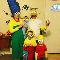 a family dressed up in costumes for halloween