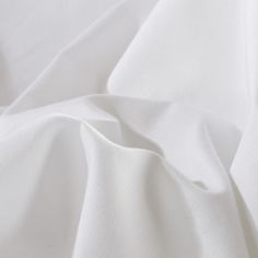 an image of white sheets that are very soft and wrinky in this photo