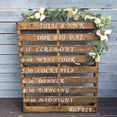 a wooden sign with flowers on it that reads june and nick our big day, 45 ceremony