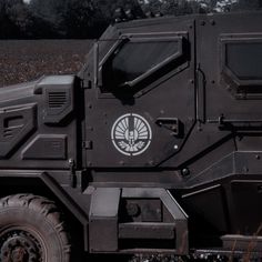 an armored vehicle is parked in the grass