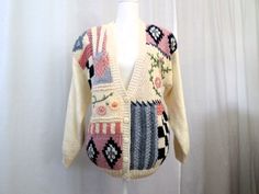 "Vtg 80s Patchwork Cottagecore Granny Cardigan Sweater Shoulder Pads Margules Ramie Blend Size S  Korea Vtg 80s Patchwork Cottagecore Granny Cardigan Sweater Shoulder Pads Margules Ramie Blend Relaxed Oversized 80s Size S Made in Korea Unique, funky, warm & cozy, rad, cool one of a kind cardigan sweater, relaxed fit with large shoulder pads!  C O N D I T I O N In good pre-loved, vintage condition. Ready to wear, no issues other than some regular wear, sold as is. Being an item over 35 years old, there may be natural signs of age or possible wear, but I have found no other issues. MEASUREMENTS: Shoulder to Shoulder: 21\" Bust: 20\" Pit to Pit: 20\" Waist: 19\" Hips: 14\" stretches to 20\" Length: 25\" Sleeve Length shoulder to wrist: 17\" V Neck top to 1st Button: 14\"" Spring Vintage Patchwork Cardigan, Retro Patchwork Cardigan For Spring, Vintage Patchwork Sweater For Spring, Spring Vintage Patchwork Sweater, Retro Patchwork Sweater For Spring, Vintage Multicolor Patchwork Cardigan, Granny Cardigan, Cardigan Cottagecore, Granny Sweater